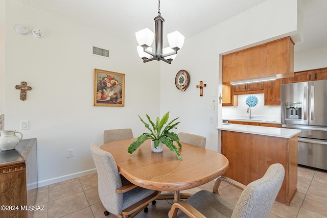 dining room with visible vents, baseboards, light tile patterned flooring, and an inviting chandelier