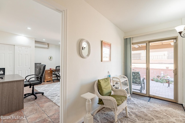 office space featuring an AC wall unit and baseboards