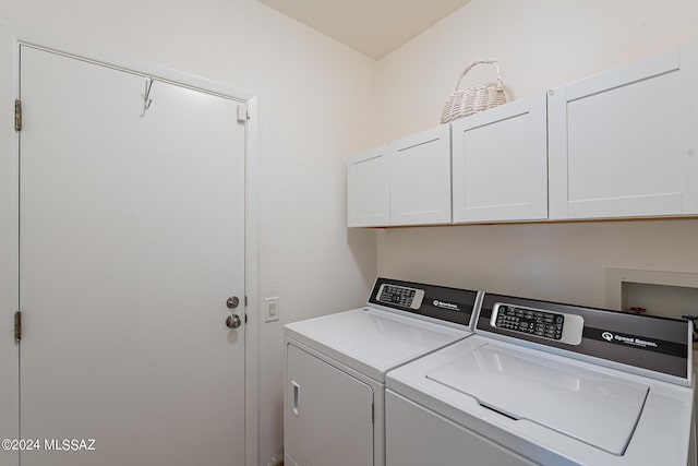 laundry room featuring cabinet space and washer and dryer