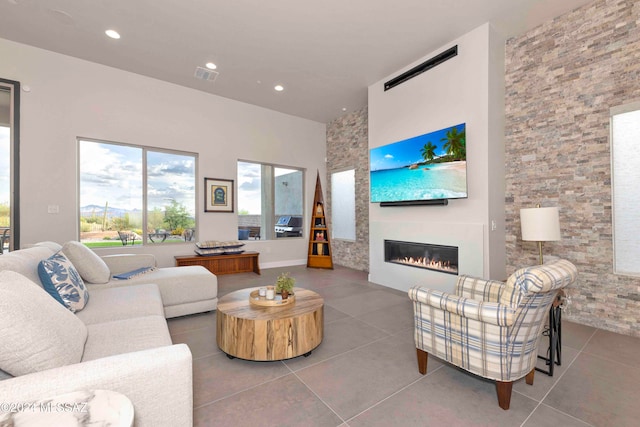 tiled living room with a fireplace