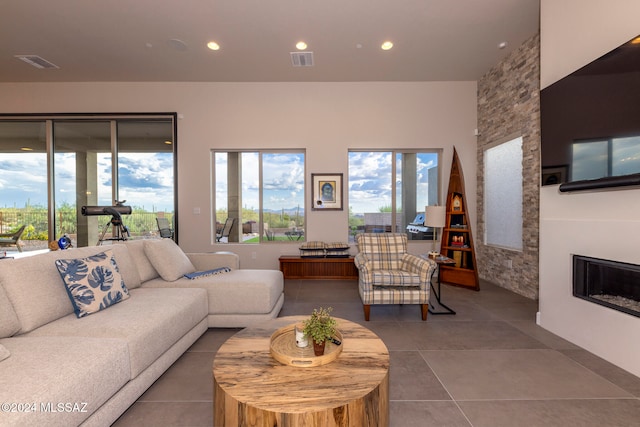 tiled living room featuring a fireplace