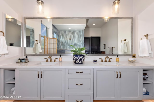 bathroom with a shower and vanity