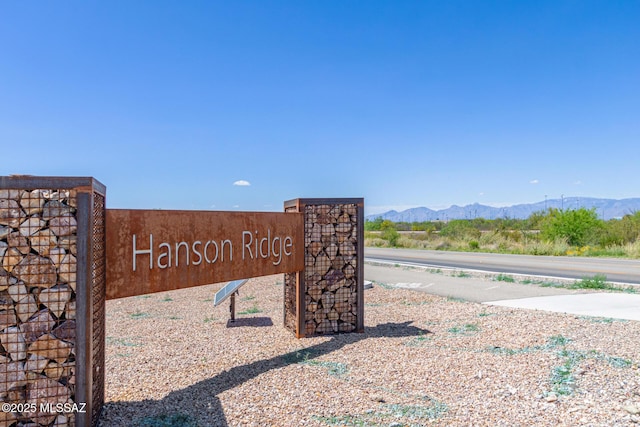 community sign featuring a mountain view