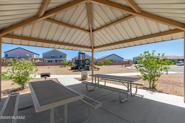 view of patio / terrace with a gazebo and a playground