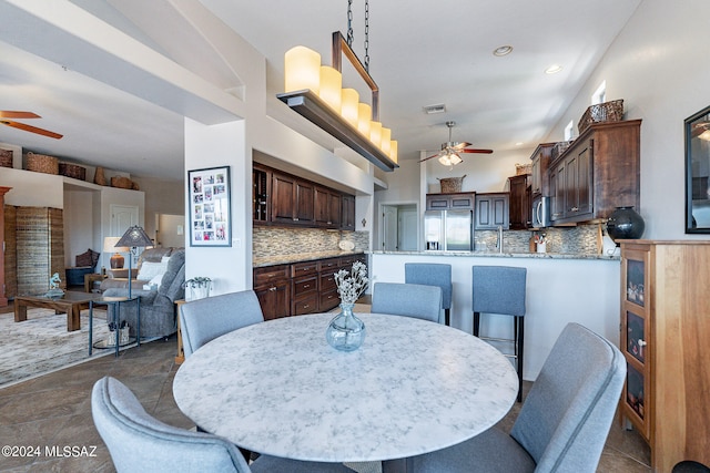 dining room with sink and ceiling fan