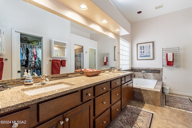 bathroom featuring vanity, separate shower and tub, and tile patterned flooring