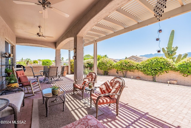 view of patio / terrace featuring a pergola and ceiling fan