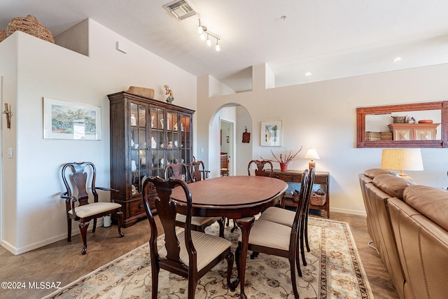 dining room featuring vaulted ceiling