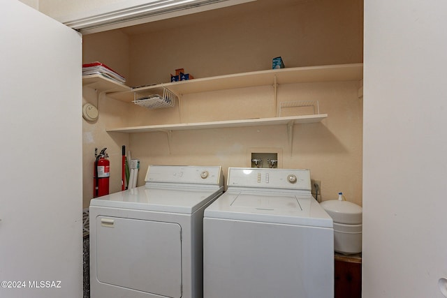 washroom with washer and clothes dryer