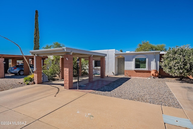 view of front facade with a carport