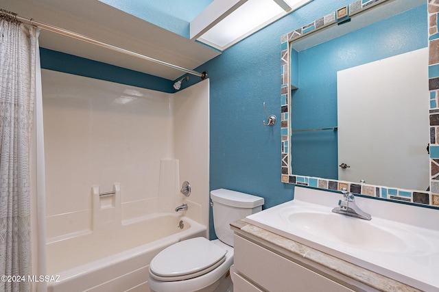 full bathroom with vanity, shower / bath combo with shower curtain, and toilet