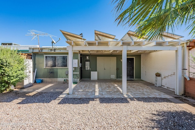 back of property with a patio and a pergola