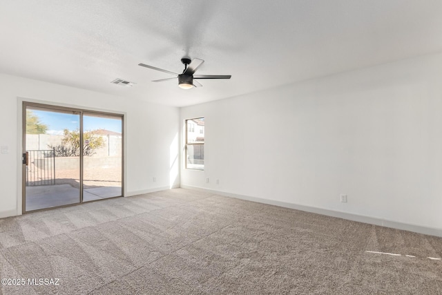 unfurnished room with ceiling fan and light colored carpet