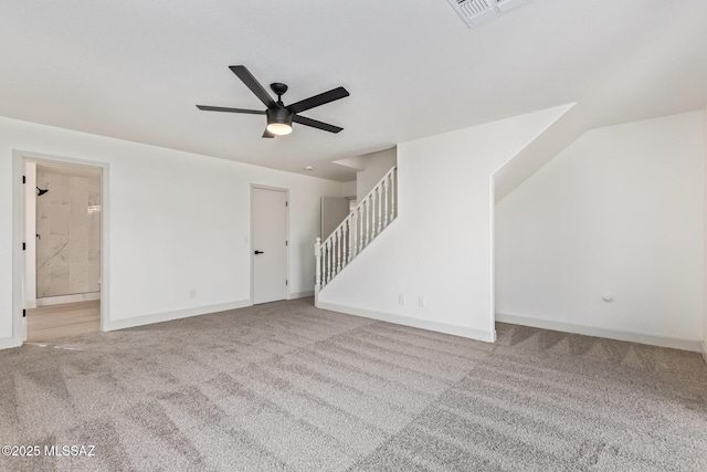 unfurnished living room featuring ceiling fan and carpet floors