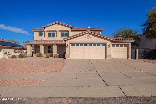 mediterranean / spanish house with a garage