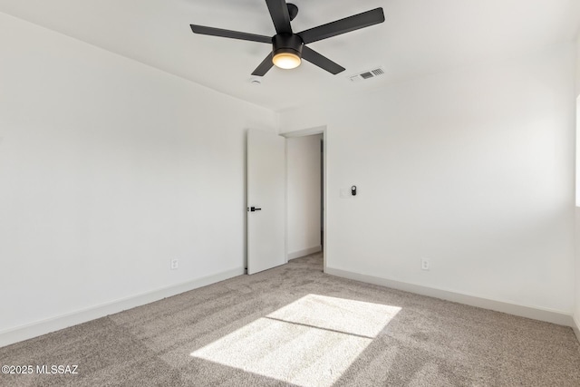 spare room with carpet flooring and ceiling fan