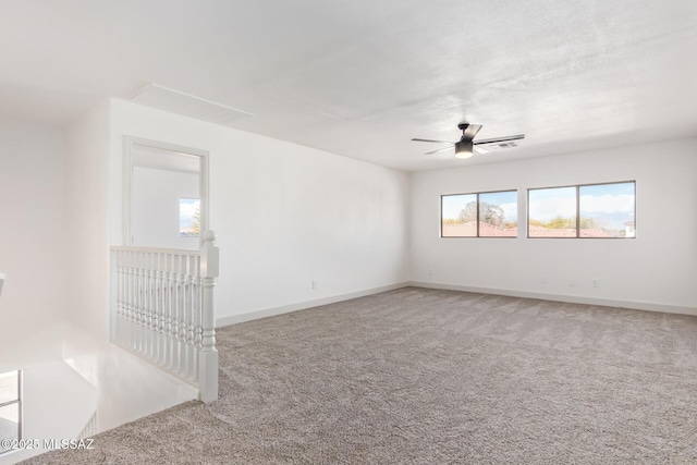 empty room featuring ceiling fan and carpet flooring