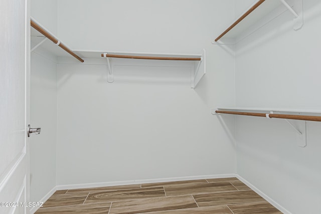 walk in closet featuring wood-type flooring