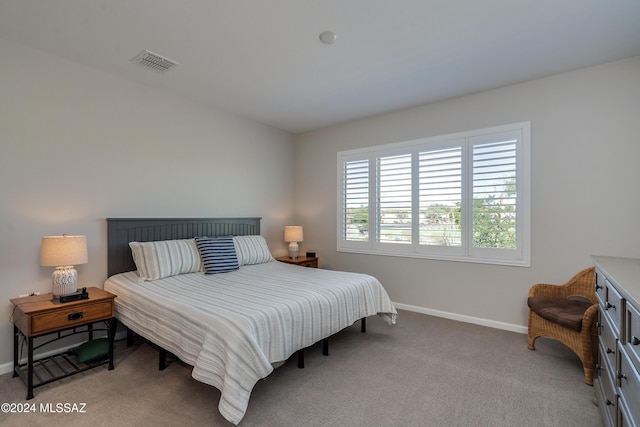 bedroom with light carpet