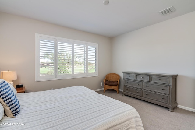 bedroom with light colored carpet