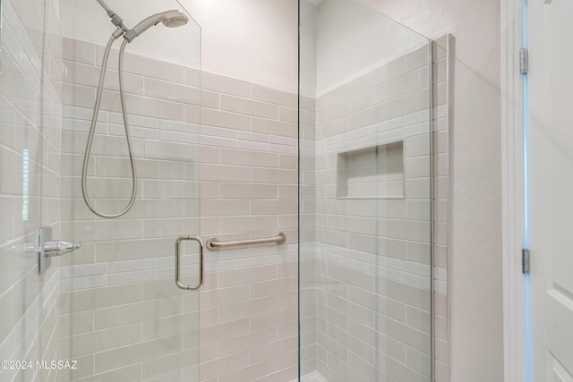 bathroom with an enclosed shower