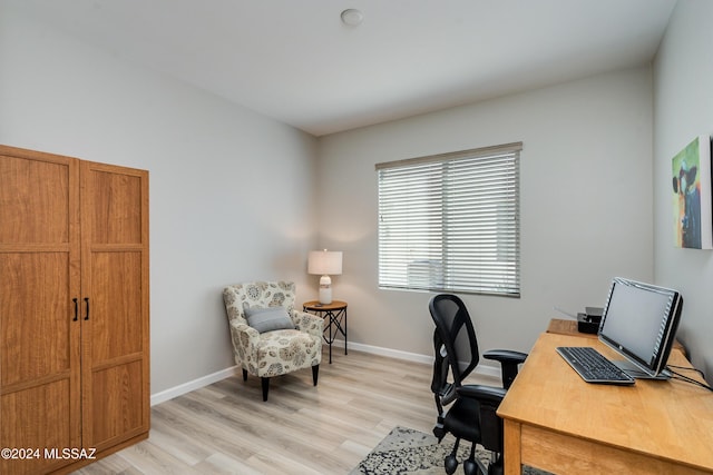 office space with light hardwood / wood-style flooring