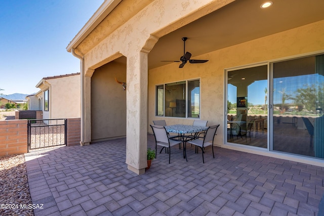 view of patio featuring ceiling fan