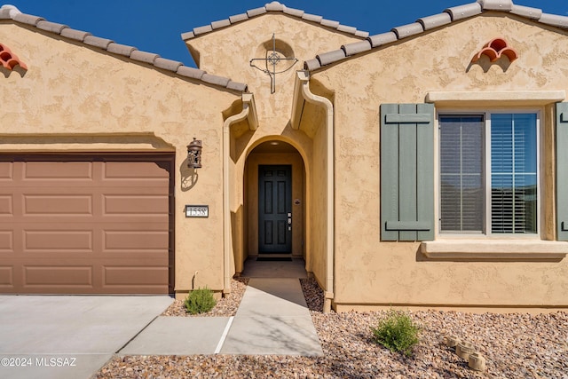 entrance to property with a garage