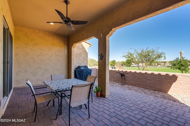 view of patio featuring grilling area and ceiling fan