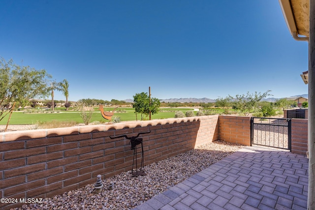 view of patio / terrace with a mountain view