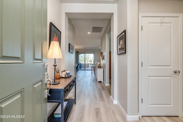 corridor featuring light hardwood / wood-style floors