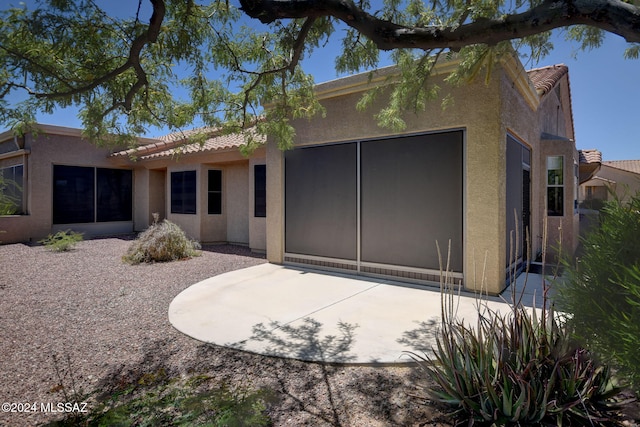 rear view of house featuring a patio area