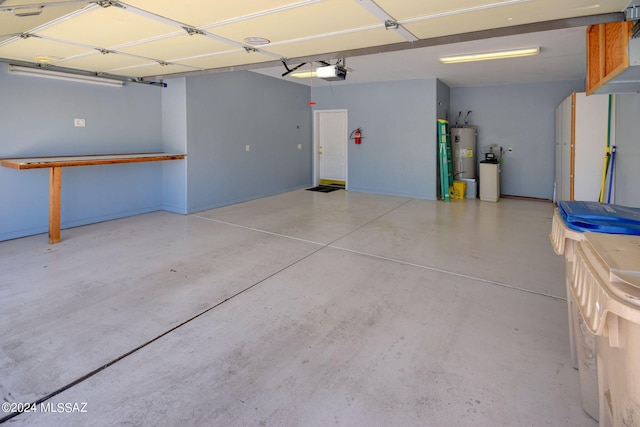 garage with a garage door opener and water heater