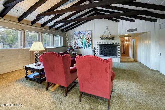 carpeted living room with beam ceiling, wooden walls, and high vaulted ceiling