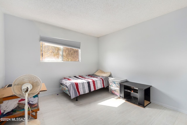 bedroom featuring a textured ceiling