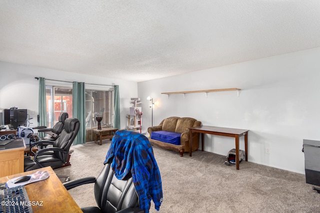 carpeted office featuring a textured ceiling