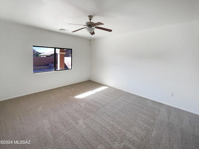 empty room with carpet and ceiling fan