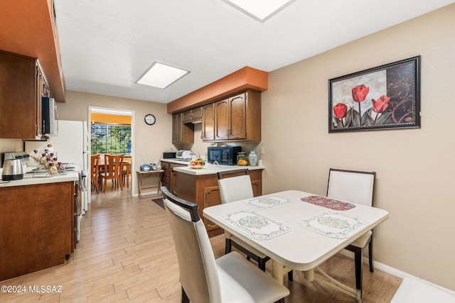 dining area with light hardwood / wood-style flooring