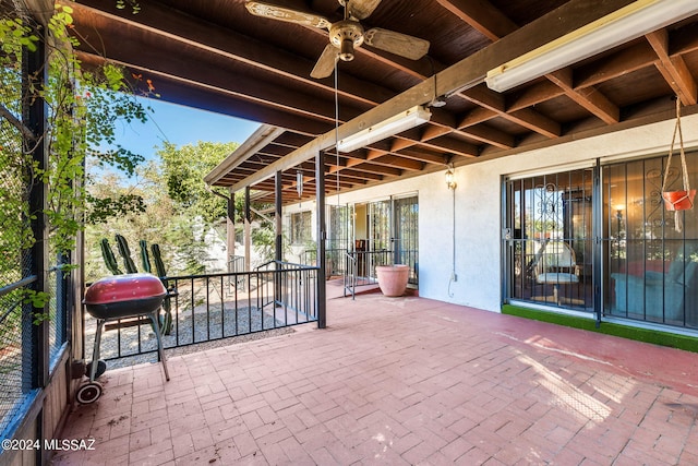 view of patio with ceiling fan and grilling area