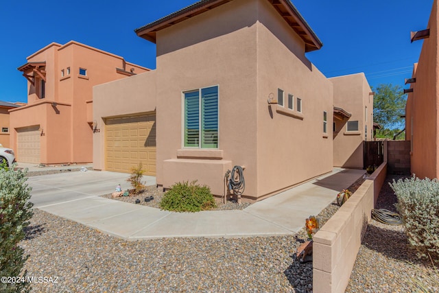 view of side of property featuring a garage