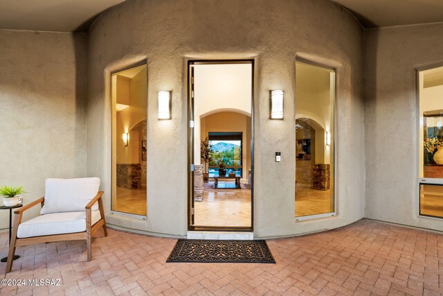 doorway to property featuring a patio area