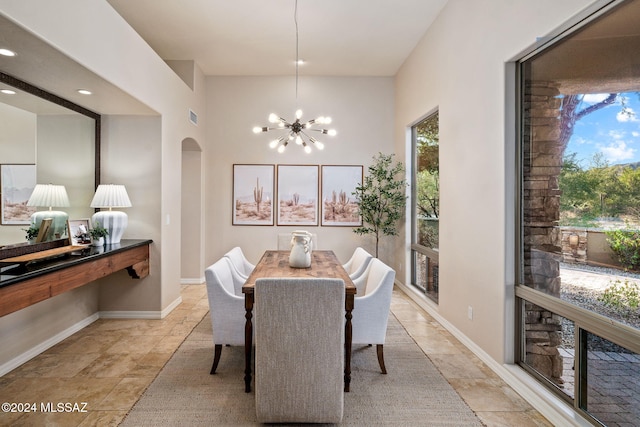 dining space featuring a notable chandelier