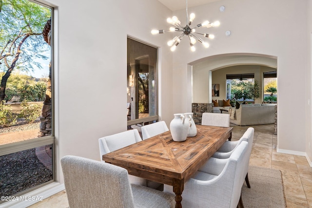 dining space featuring a notable chandelier