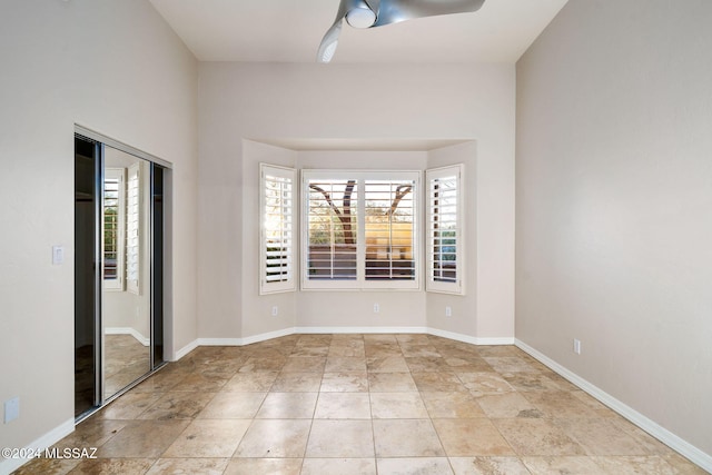 unfurnished room featuring ceiling fan