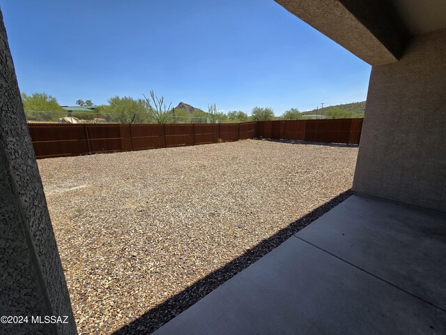 view of yard with a fenced backyard and a patio area