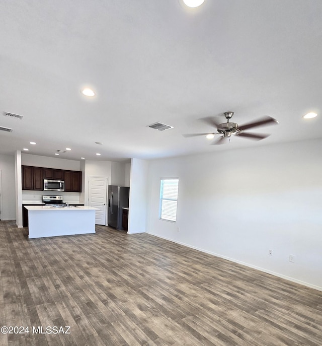unfurnished living room featuring visible vents, recessed lighting, and dark wood-type flooring