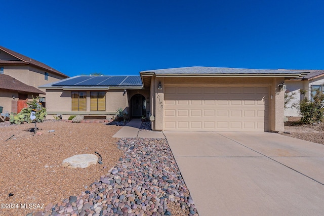 single story home with a garage