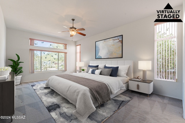 carpeted bedroom featuring ceiling fan