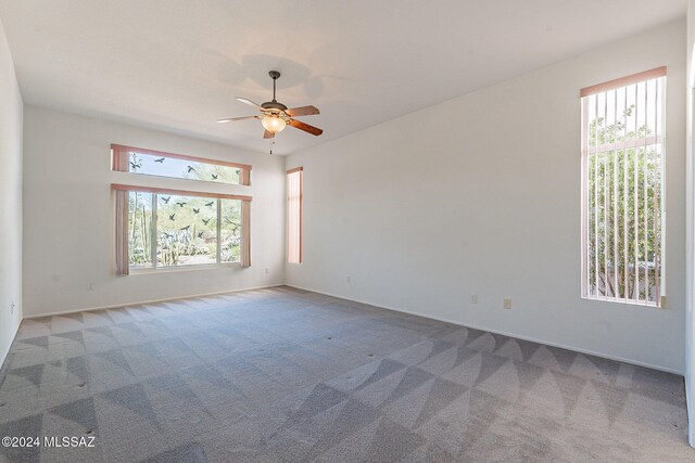 carpeted empty room with ceiling fan