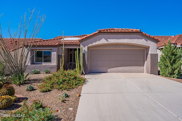 view of yard with a mountain view and a garage